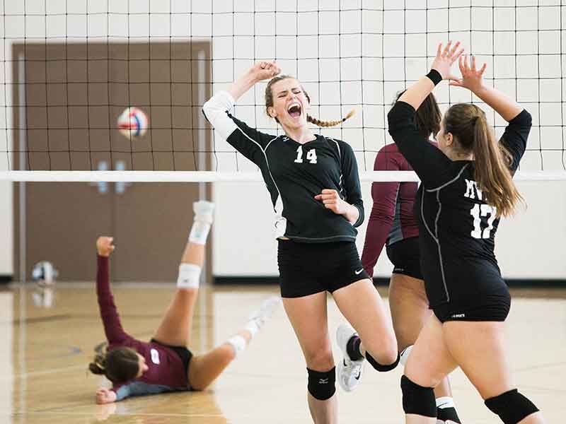 the girls play volleyball